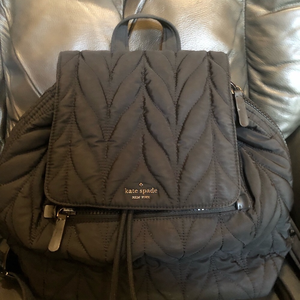 Kate Spade nylon quilted black backpack in gently used condition.